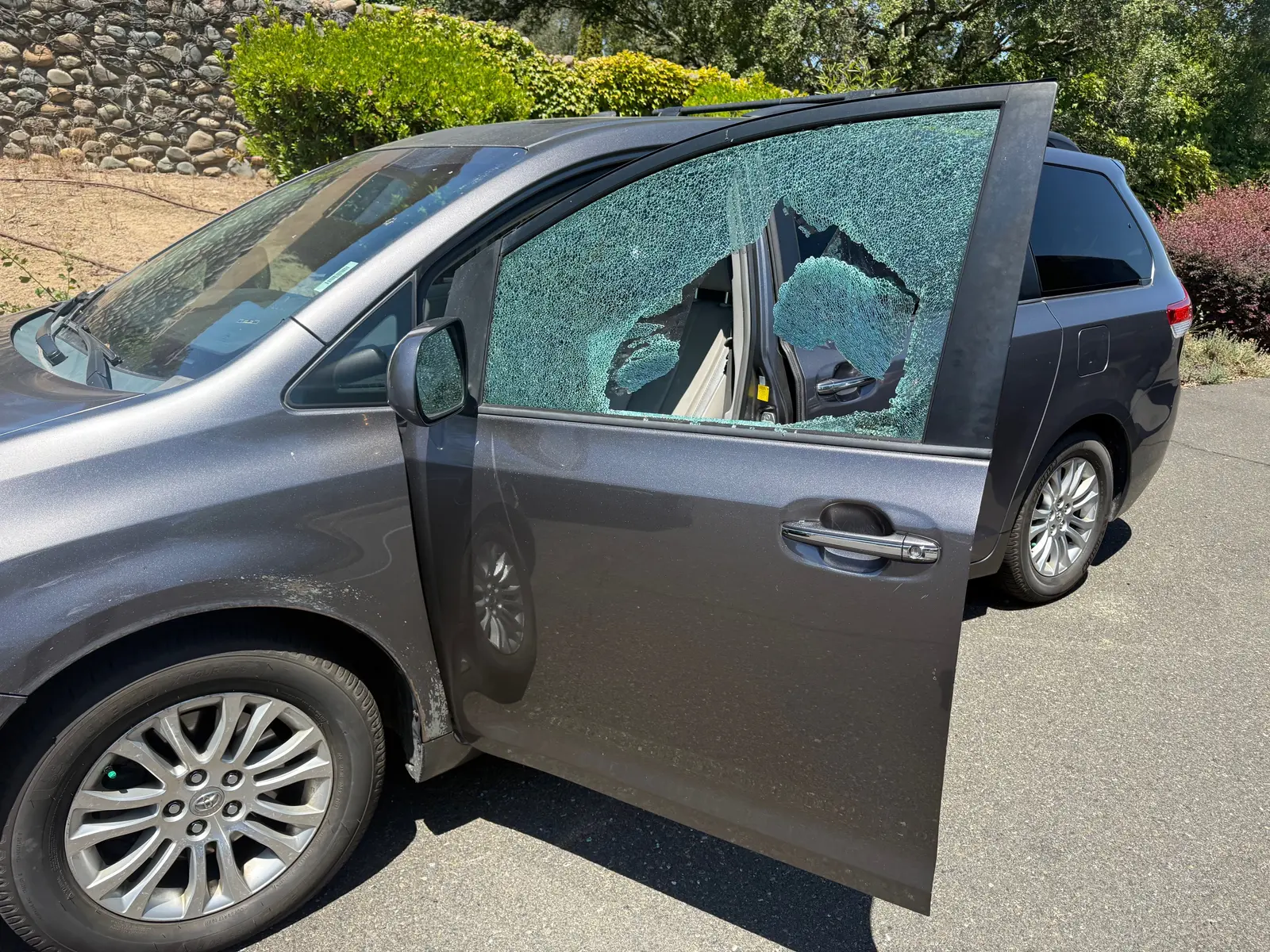 Shattered car door window before replacement