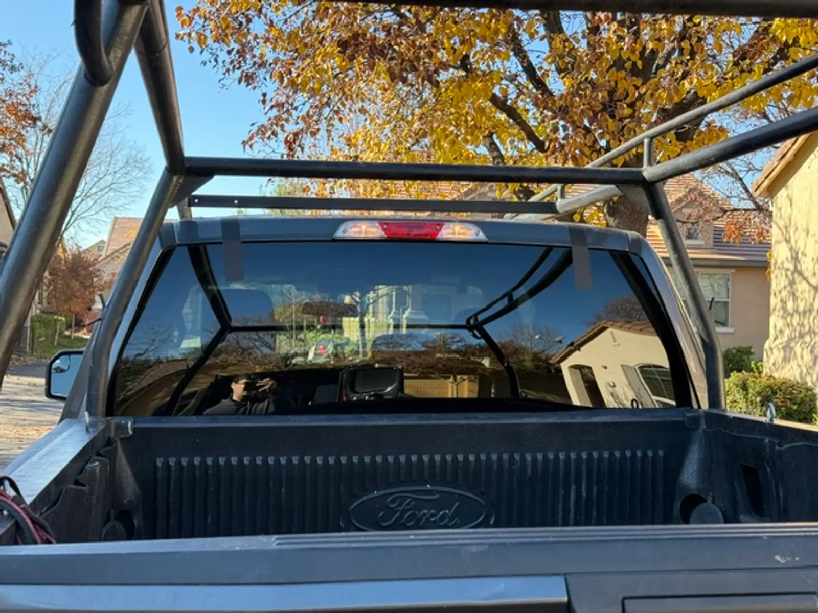 New rear window installed on a Ford truck after replacement