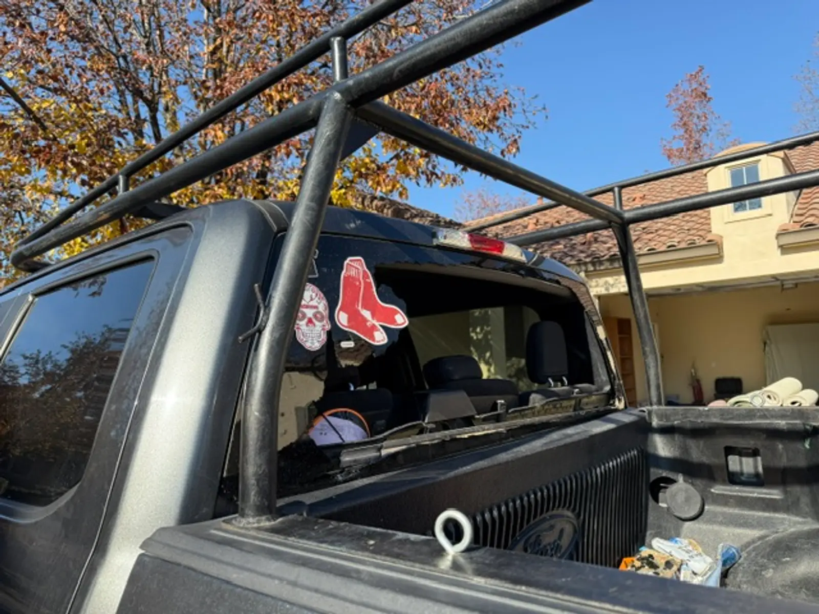 Broken rear window on a Ford truck before replacement