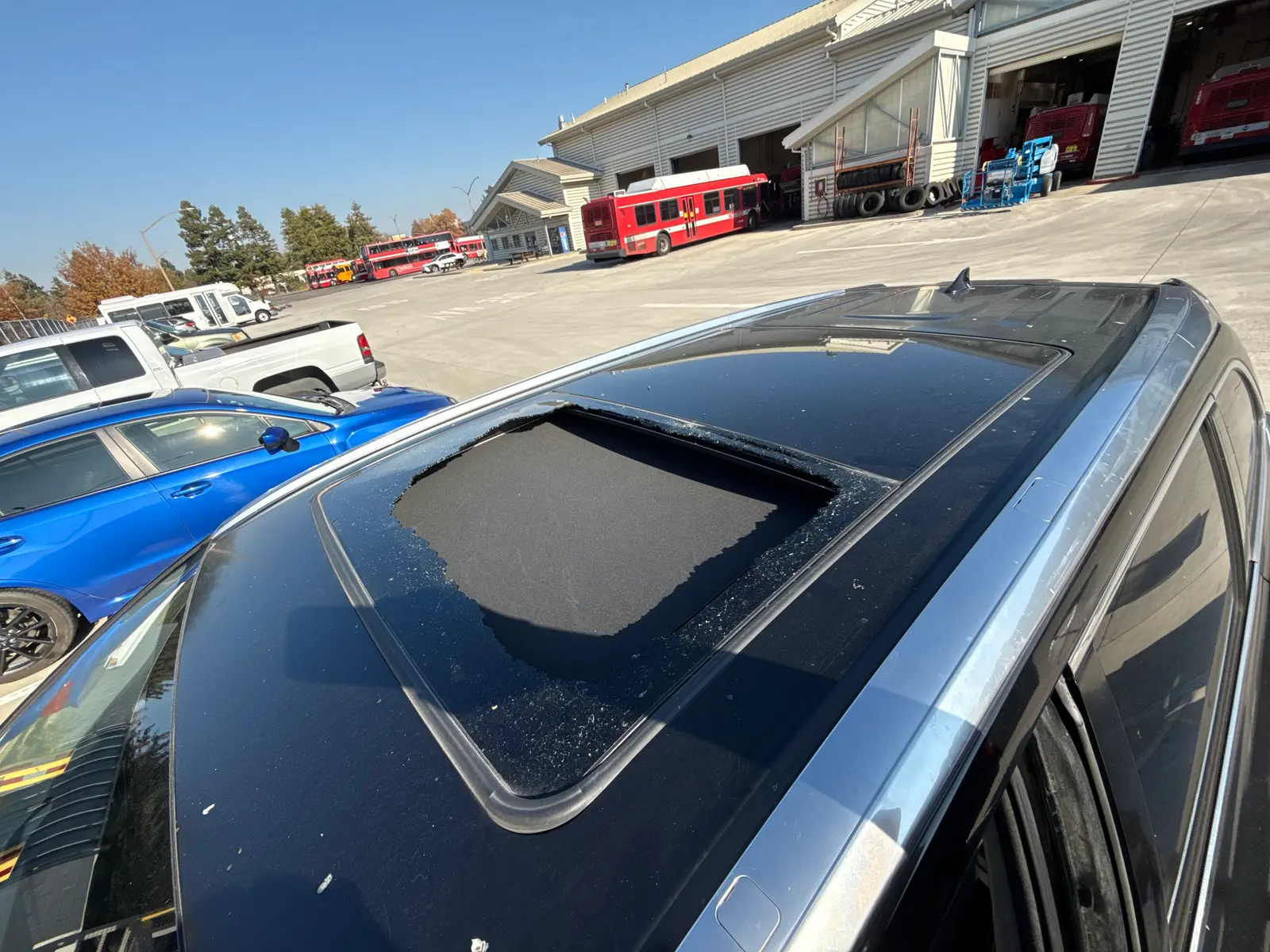 Shattered sunroof glass before replacement