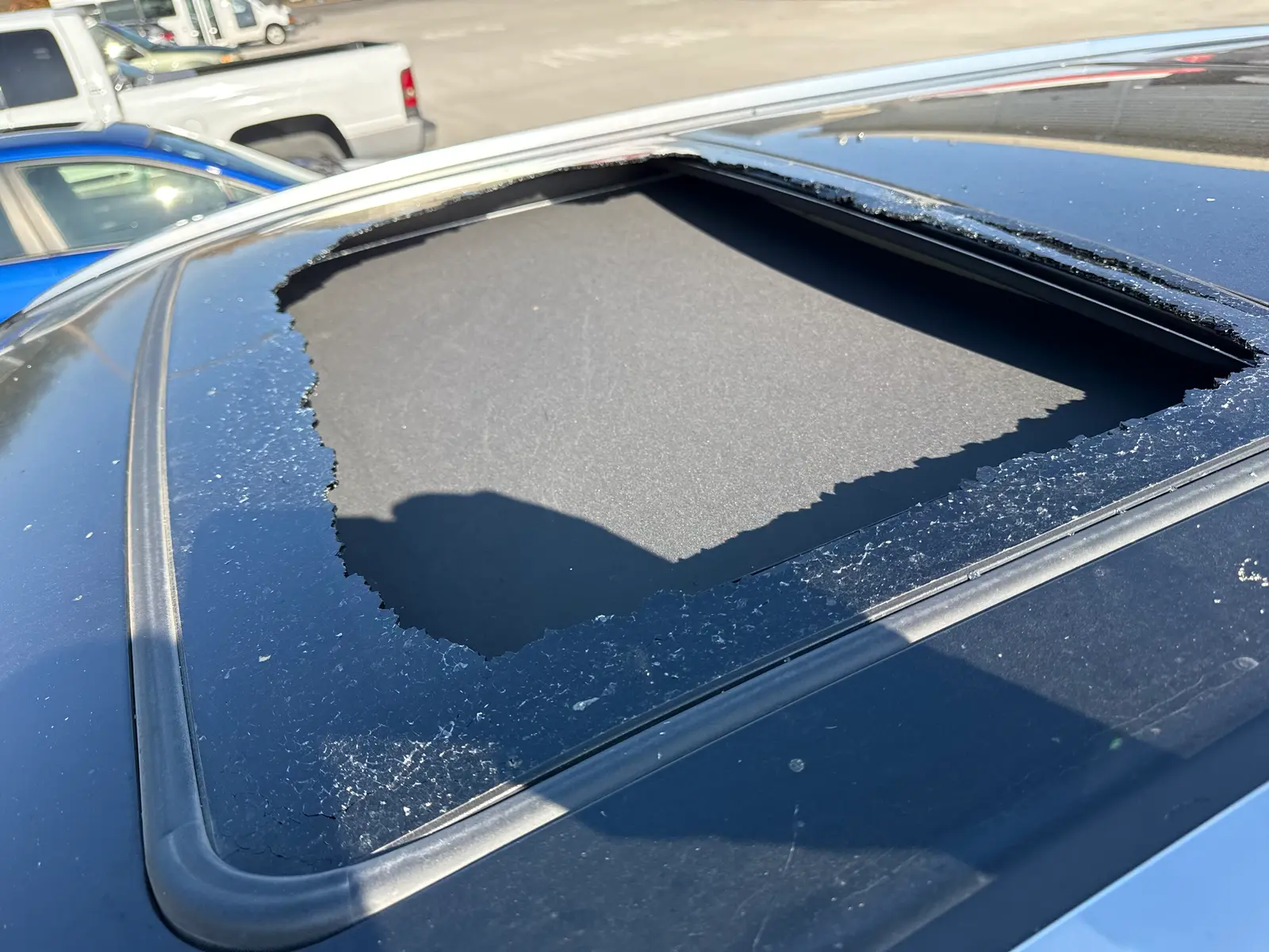 Shattered sunroof glass on a vehicle in Roseville